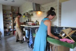 Chefs at The Holistic Academy preparing delicious vegetarian meals to nourish the body and spirit of the students during their holistic training
