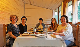 Chefs cooking fresh vegetarian food for students during holistic coach and therapist training at The Holistic Academy